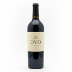 A dark glass bottle of red wine with a cream-colored label featuring the brand name 'DVO' and 'Napa Valley 2018' printed in black text.