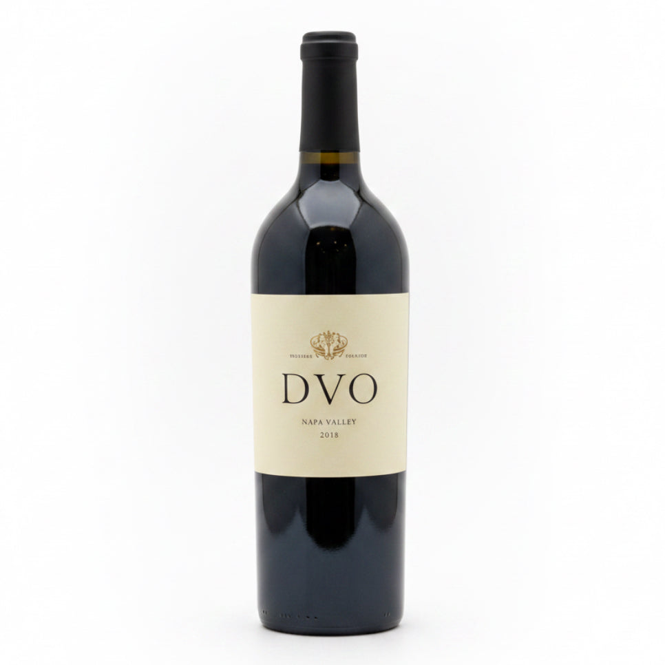 A dark glass bottle of red wine with a cream-colored label featuring the brand name 'DVO' and 'Napa Valley 2018' printed in black text.